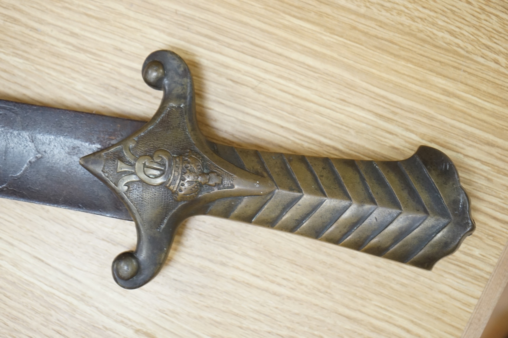 A scarce Germanic Janissary Corps sidearm, produced from 1729-31, broad single edged blade, 65cm, etched in panel with crowned cipher (faint), regulation cast brass hilt with crowned cipher and chevron grip